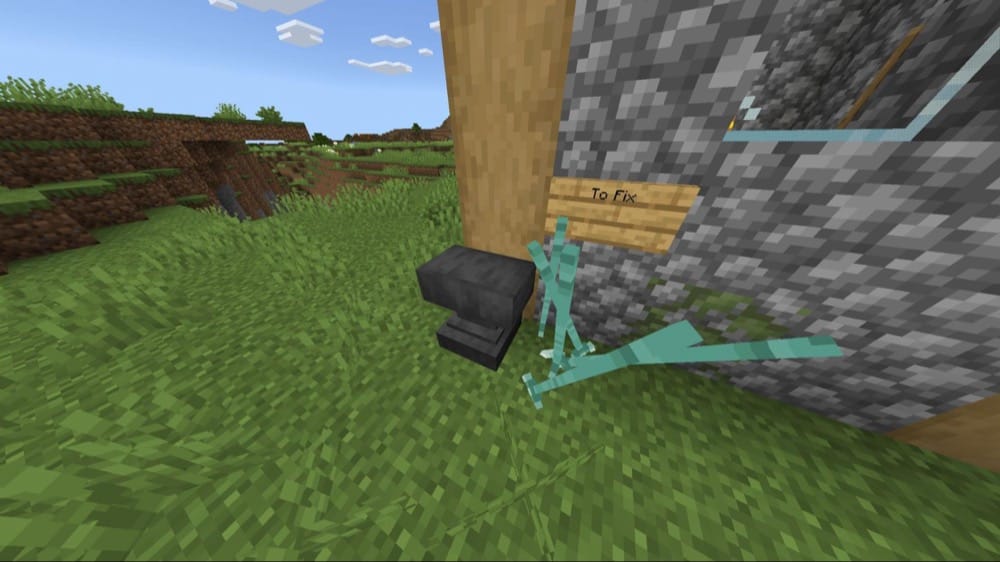 A Minecraft screenshot of many tridents thrown into the ground next to an anvil.