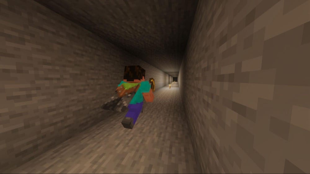 A Minecraft screenshot of the player holding an enchanted pickaxe in a long underground tunnel.