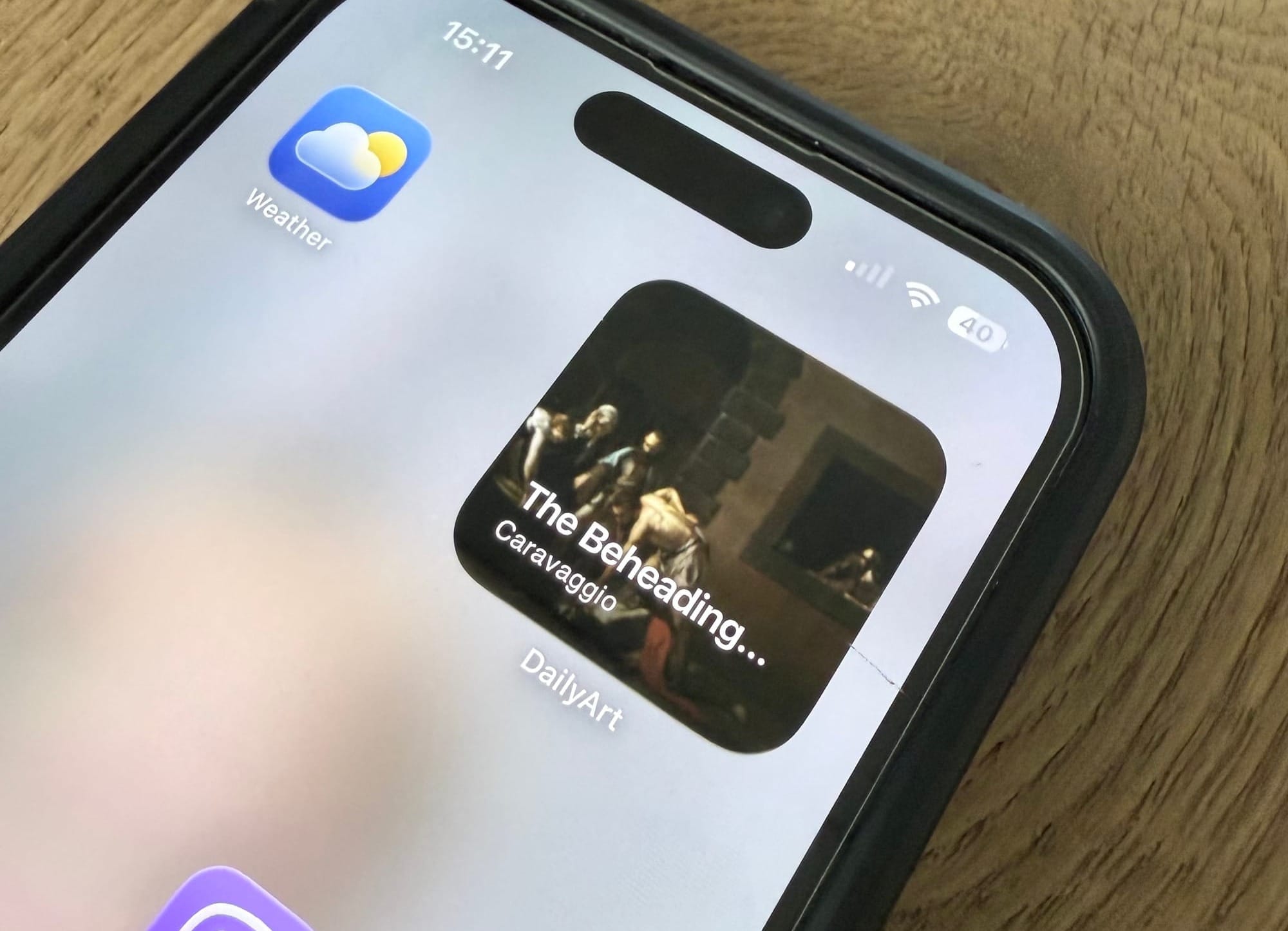 The DailyArt widget on an iPhone home screen showing a Caravaggio painting.
