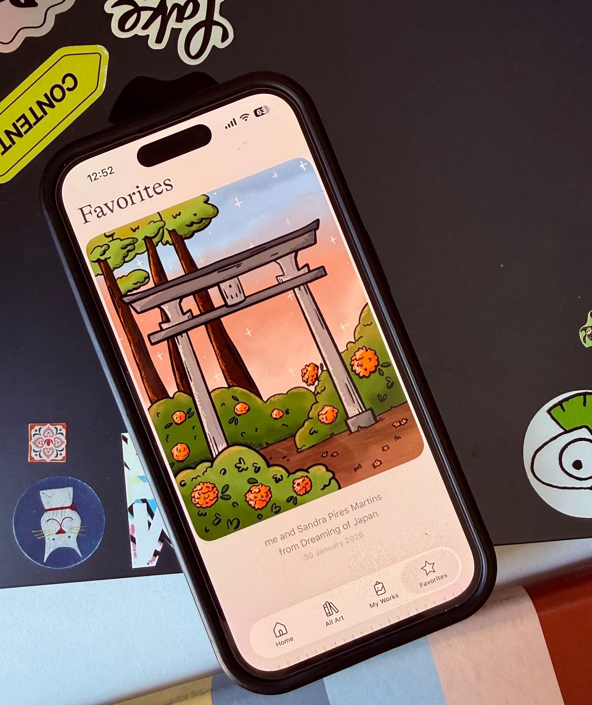 A completed coloring page of a Japanese torii gate in the Lake app.