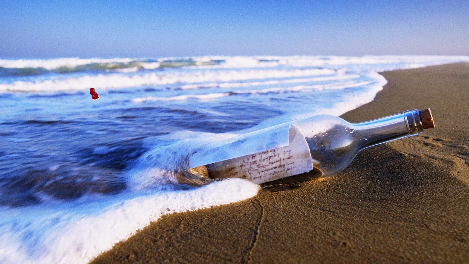 A slip of paper in a bottle washing up on a shore