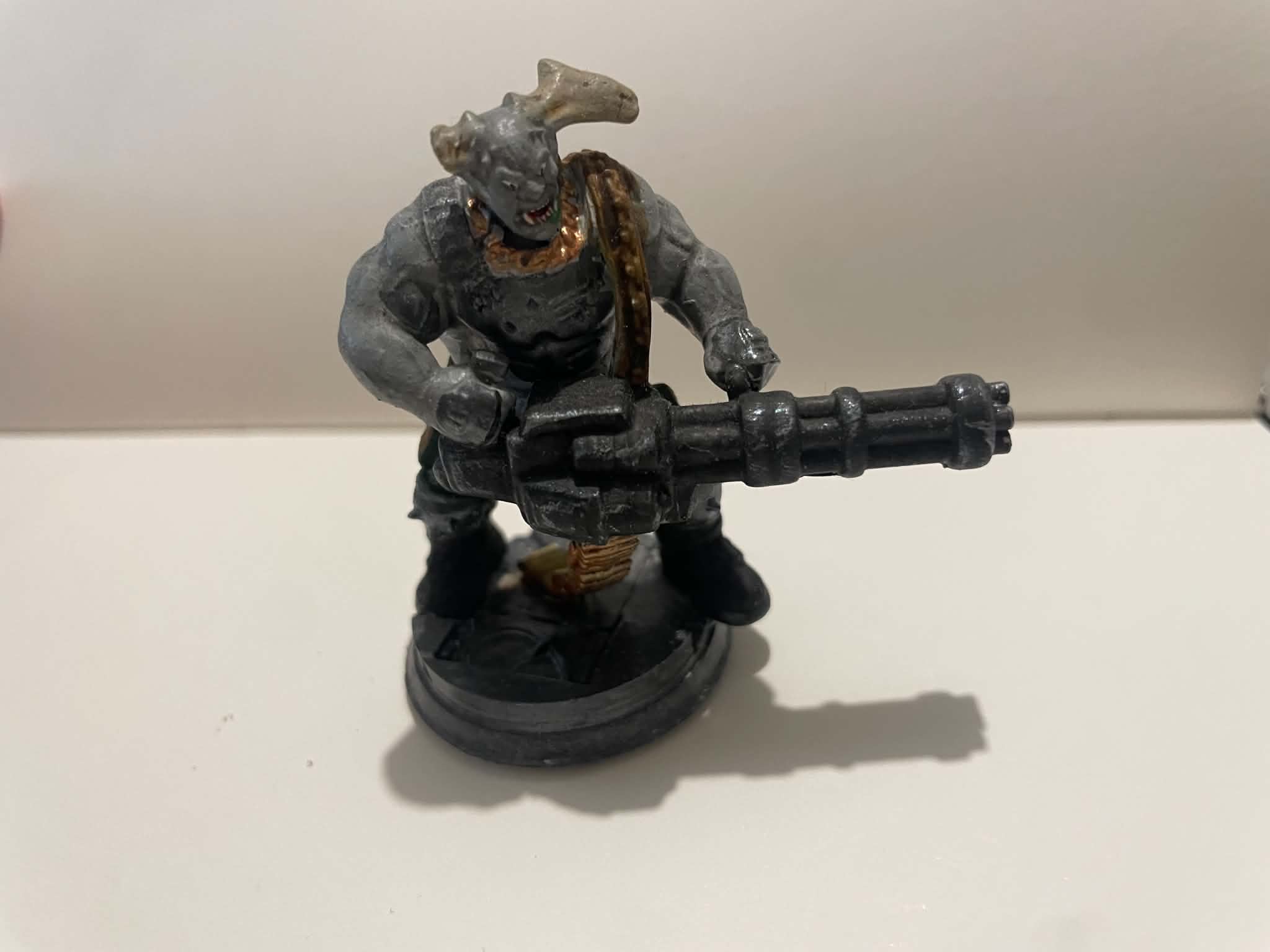 A miniature troll with a minigun