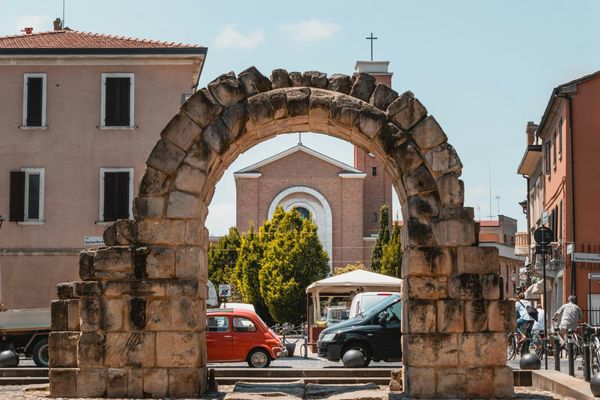 The arch holds because every stone is in place. Nobody built it again. Nobody had to.