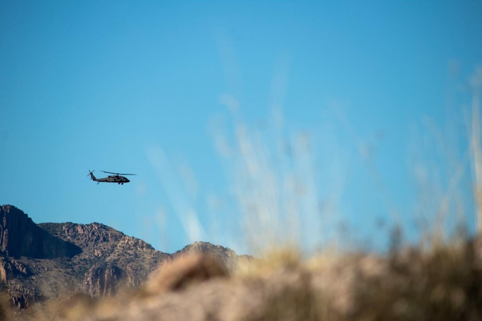 A helicopter flying over a mountain

AI-generated content may be incorrect.