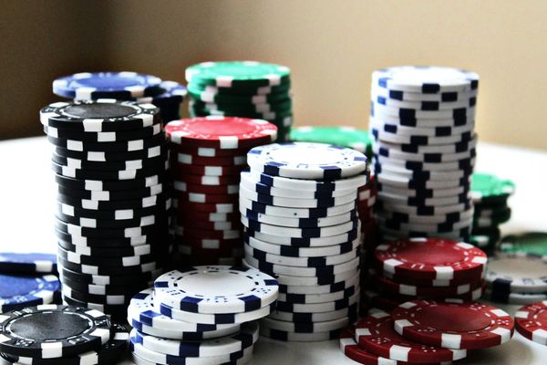 Colorful poker chips stacked on a table
