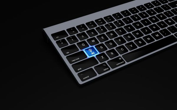 Black backlit keyboard on a black background with an illuminated "AI" key
