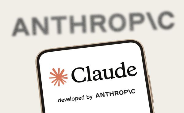 Claude and its logo showed on the splash screen of a phone with the Anthropic wordmark in the background