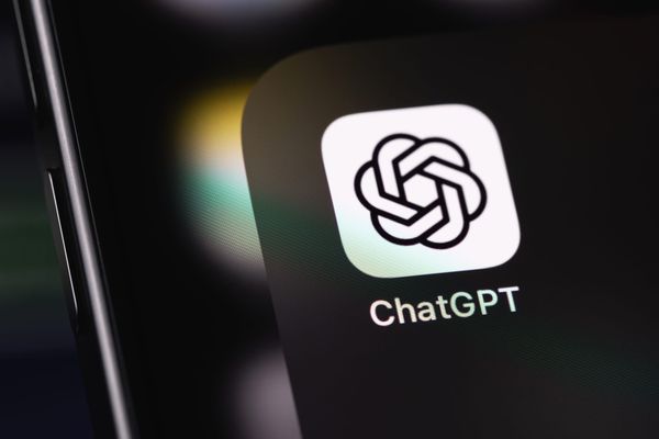 The ChatGPT app icon shown on a black smartphone screen