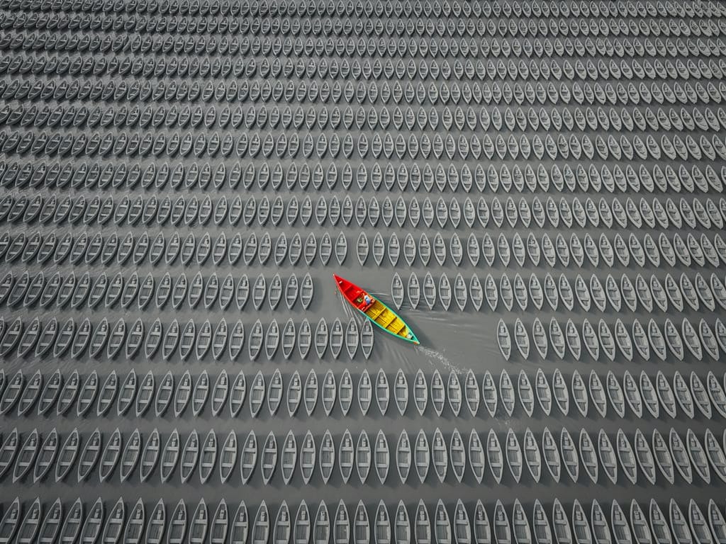 A single unique canoe in a sea of uniformity