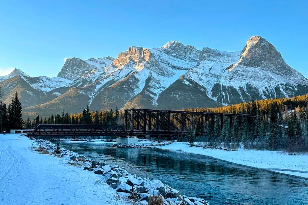 Morning Sun Lights Up Ha Ling Peak As It Towers Over Canmore Engine Bridge Alberta Canada