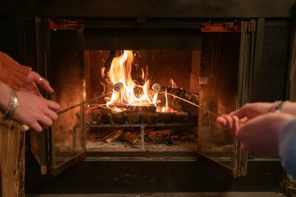 Hidden Ridge Resort Banff Alberta Canada Fireplace Roasting Marshmallows