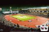 A rendering showing the LA Coliseum hosting track and field events during the 2028 Olympics with the logo in the corner