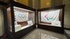 The Olympic and Paralympic flags shows installed in huge wooden display cases in LA's City Hall