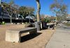 Dozens of concrete benches for the 1984 Olympics are lined up outside the Coliseum in LA's Expo Park