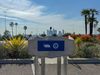 A podium set up in the Dodger Stadium parking lot with the governor's bear logo and the Dodger Foundation logo