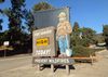 A wooden Smokey the Bear sign in Griffith Park says Prevent Wildfires and shows Fire Danger: HIGH
