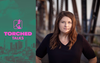 The Torched Talks logo in front of an LA skyline with Jessica Henson standing on a bridge in a black shirt