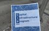 A document reading Capital Infrastructure Program with a map of LA with the streetscape of LA behind it