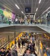 Passengers stream out of the shiny new Wilshire/La Cienega D line station on Friday