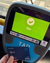 I'm using my debit card at a TAP reader to pay for the bus, and a huge green screen reads GO