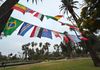 Echo Park Lake on a gloomy morning is strung with flags from all the World Cup countries