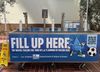 A blue hydration station with three faucets by LADWP that says "fueling the fans of LA's summer of soccer 2026"