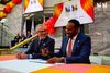 Casey Wasserman and Atlanta mayor Andre Dickens sit at a table laughing at an LA28 torch relay press conference