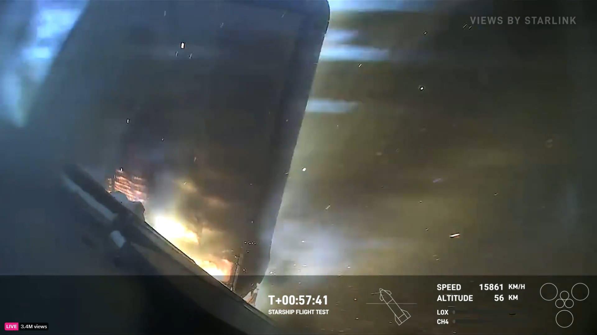 Flames jet through the space between a control flap and the body of Starship during the 5th test flight.