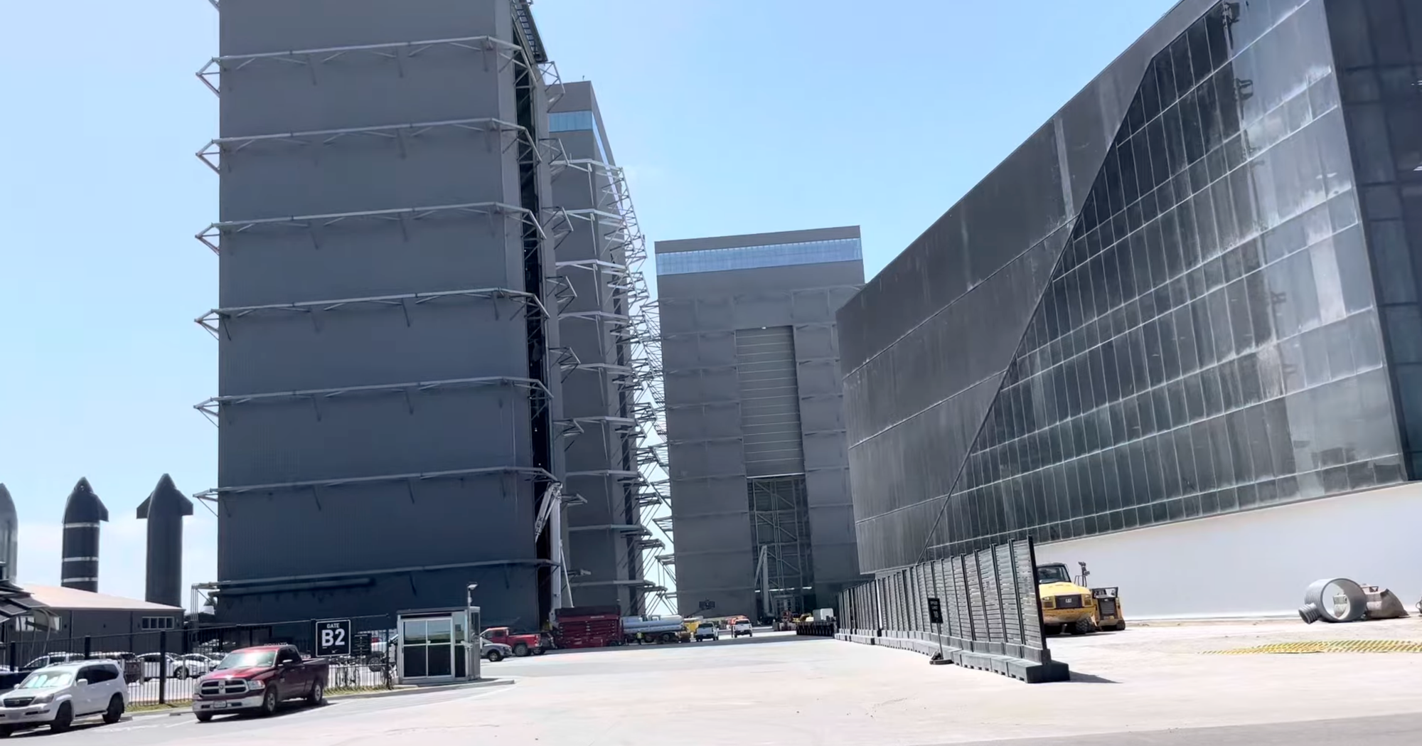 A series of large steel and glass buildings where Starships are constructed. Some prototypes stand on the blacktop outside.