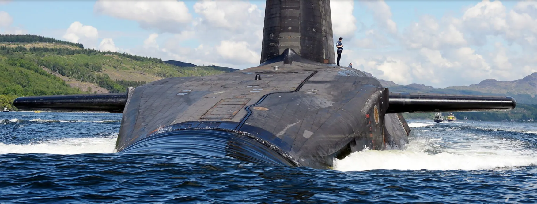 Photo of the Royal Navy Vanguard-class nuclear-powered ballistic missile submarine HMS Victorious departs HM Naval Base Clyde at Faslane in southwestern Scotland. 
