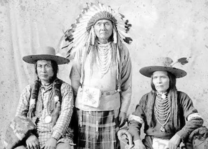Photo shows the Nez Perce Chief Joseph and two tribal members in their Native attire.