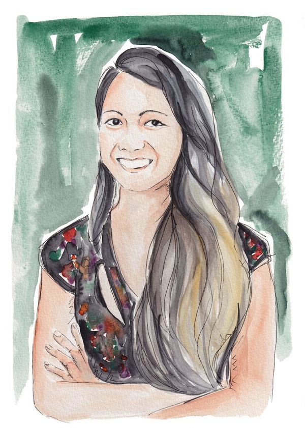 A watercolor showing Daniella Zalcman smiling in a short-sleeved top, with her long dark hair swept down one side of her face