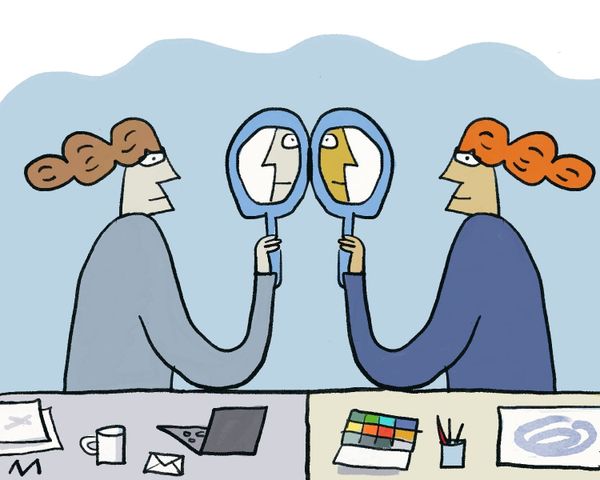 Illustration. In the foreground, a table is divided into a desk and a table with paints and paper on it. Behind them, mirror images of a woman look into a mirror.