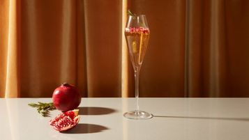 What is the Proper Way to Hold Glassware When Serving?