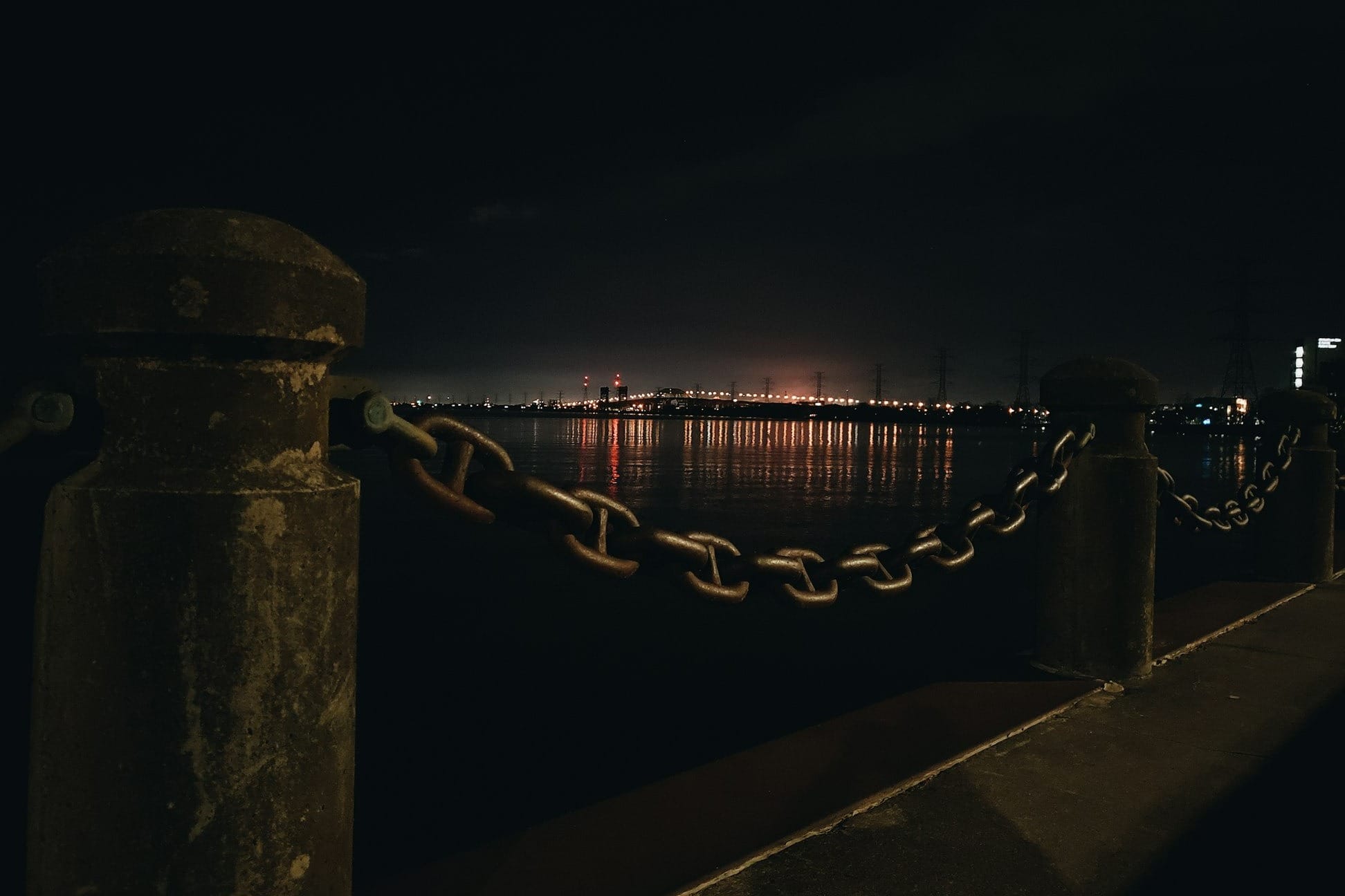 brown metal chain link fence during night time