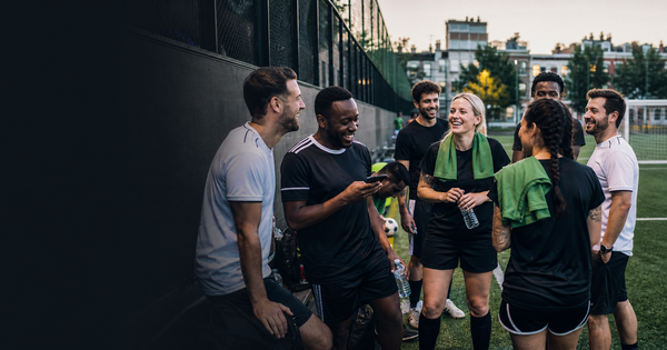  Players gathering on an outdoor pitch for a local Tekkers game.