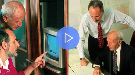 Two businessmen analyzing financial charts