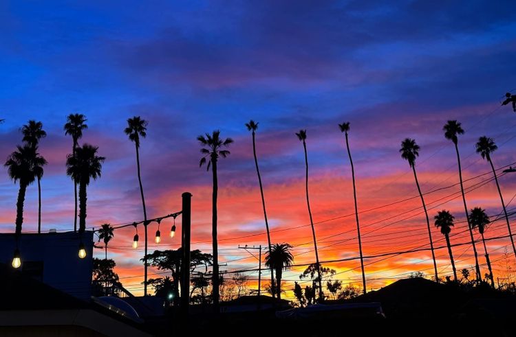 Stunning sunset of yellows, oranges, reds, purples, & blues in downtown Carpinteria's night sky.