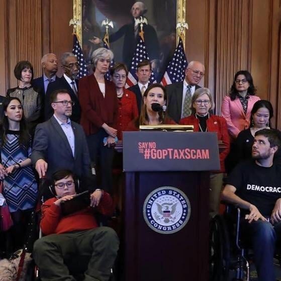 Sister Simone stands to my right, next to Elena Hung and Ady Barkan, as I speak at a press conference in the Capitol at the invitation of then-Leader Nancy Pelosi.