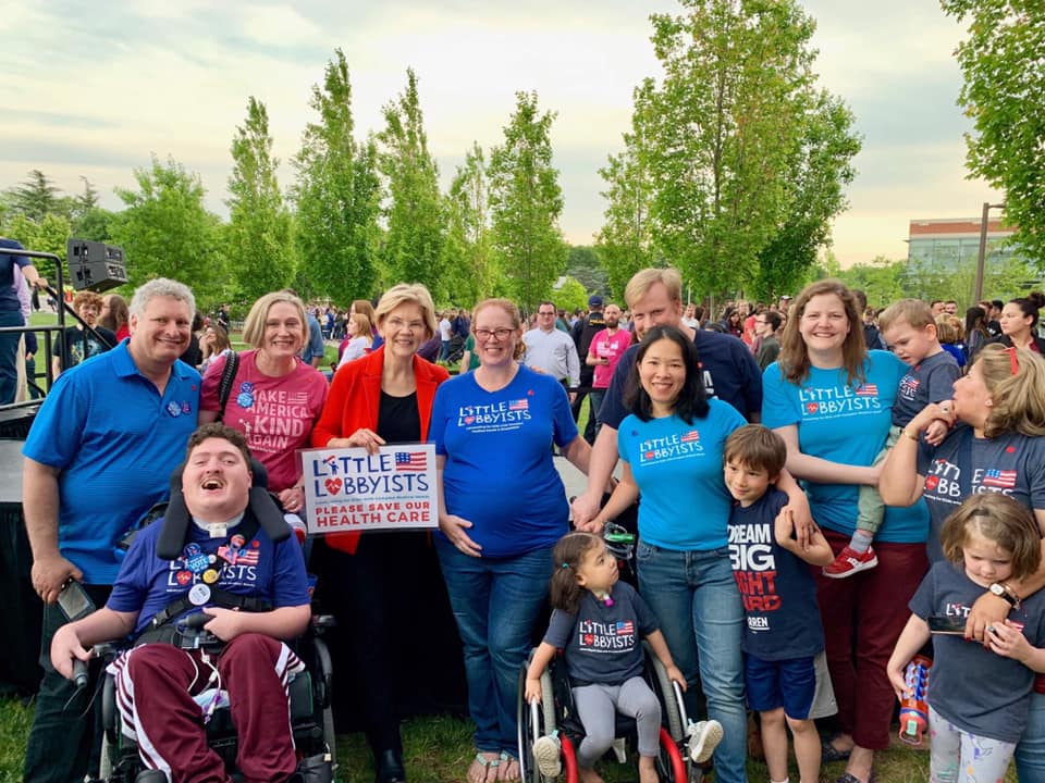 Jeneva and her family with the Little Lobbyists at a Town Hall with Senator Elizabeth Warren.