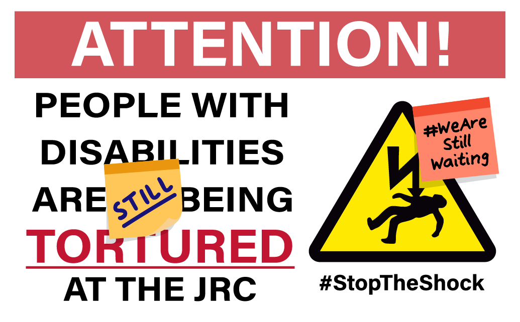 [Image description: An illustration of a construction site-style metal warning sign. At the top, white text on a red background reads: ATTENTION! Below that is large text which reads: “PEOPLE WITH DISABILITIES ARE STILL BEING TORTURED AT THE JRC.” N…