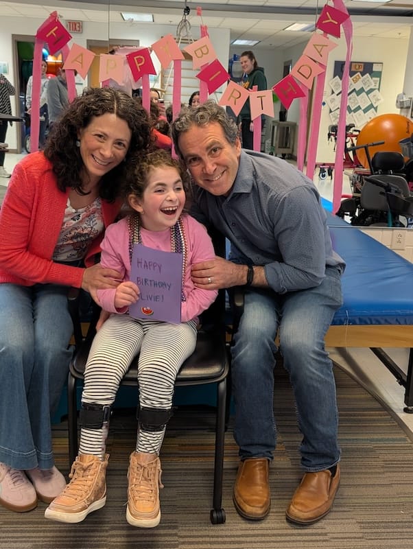 Liviana and her parents at her birthday party.