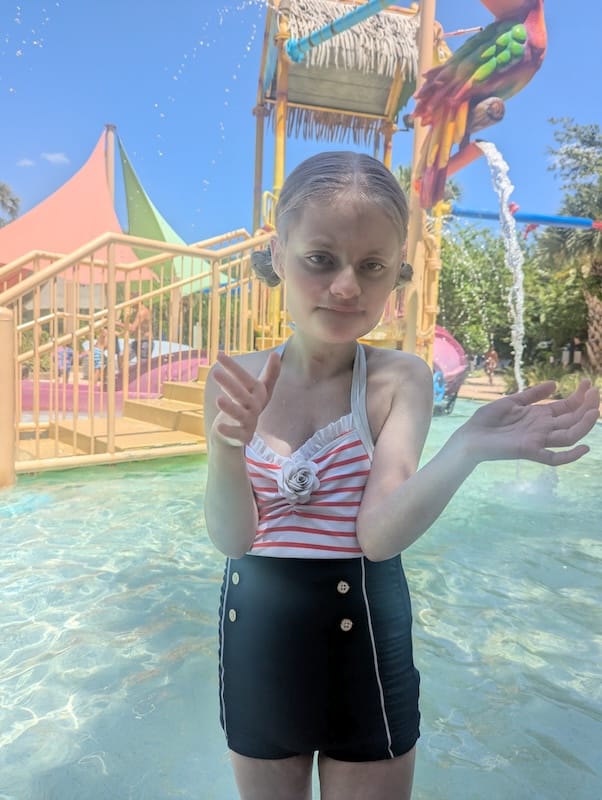 Emma in swimwear at a water park