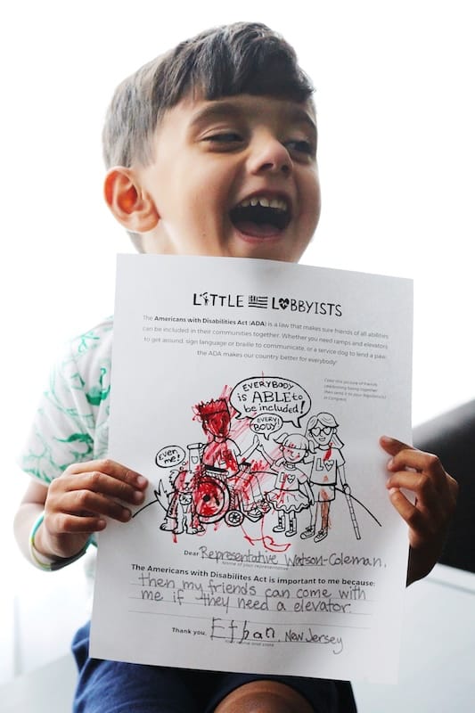 Ethan holding up a letter to his legislators