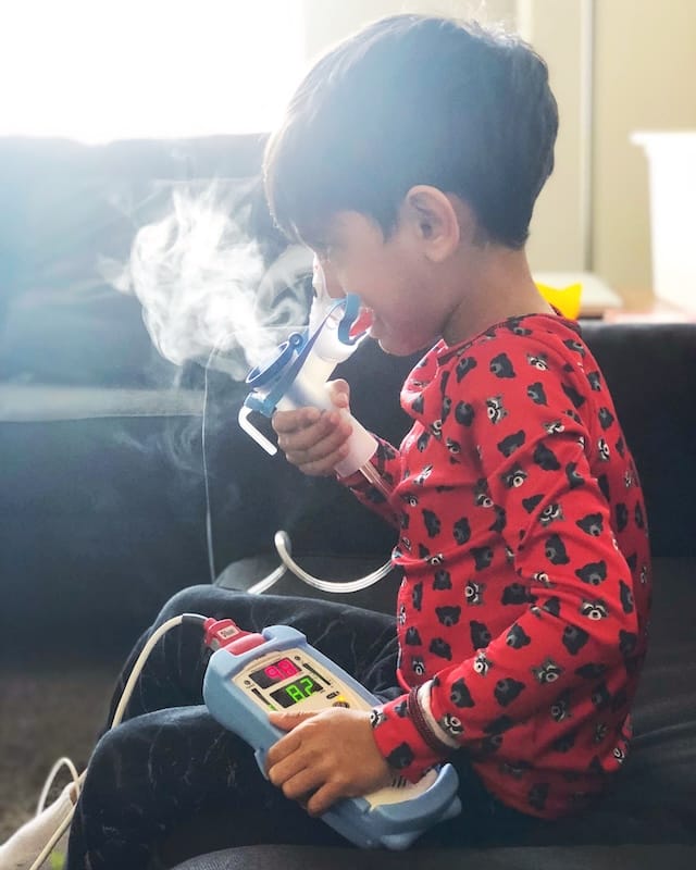 Ethan doing a nebulizer treatment