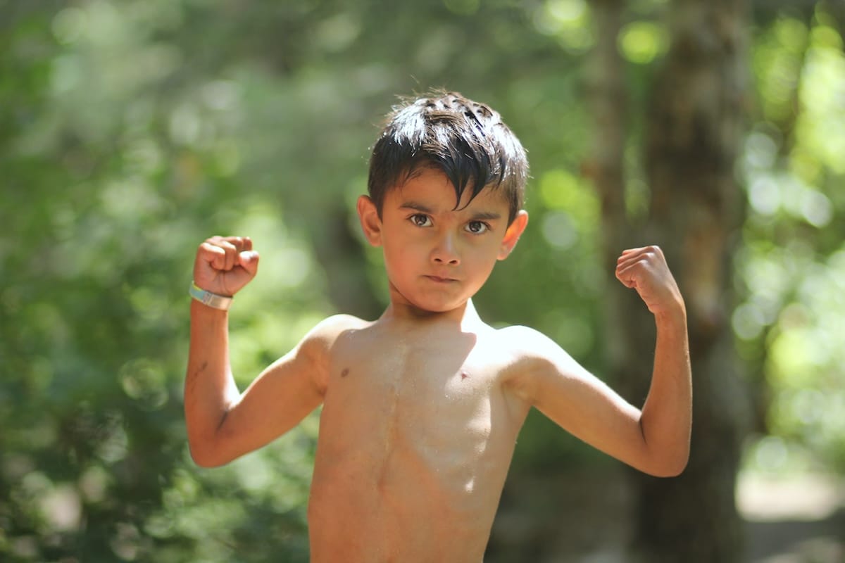 Ethan posing with his arms wide