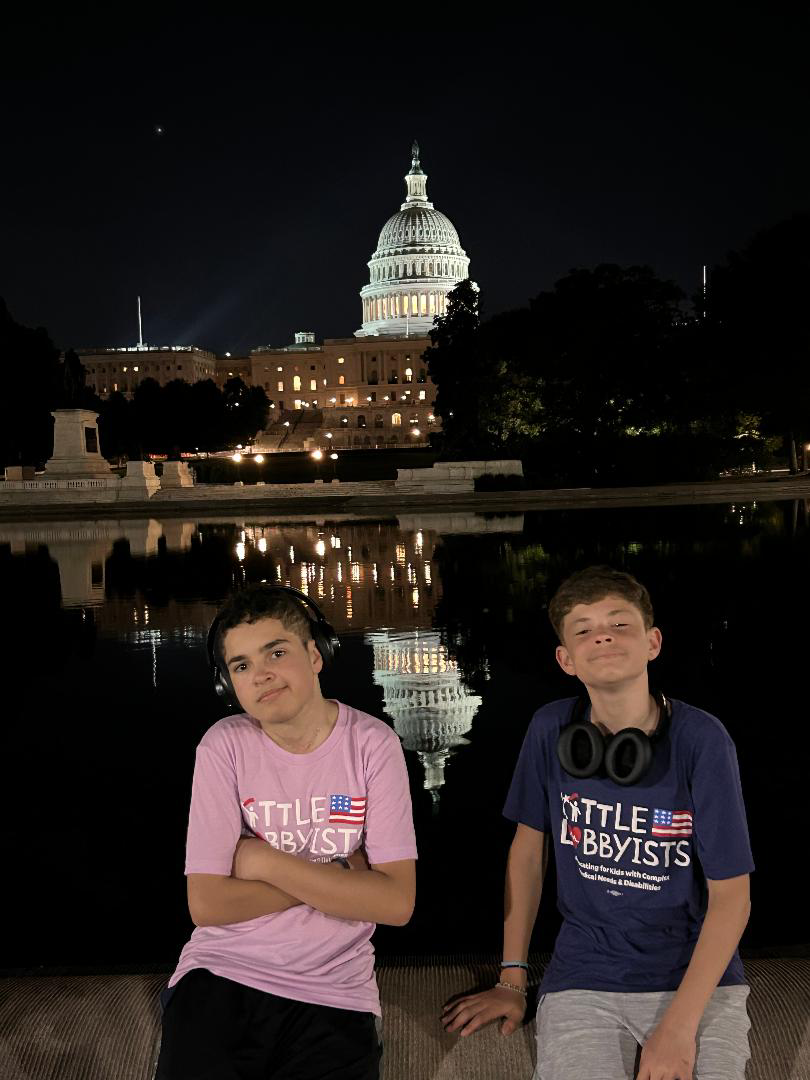 Isaac and Elijah at the US Capitol after dark.