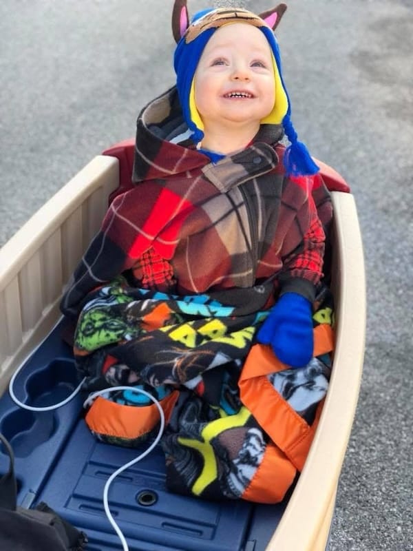 Cole wrapped up and dressed as a monster at halloween.