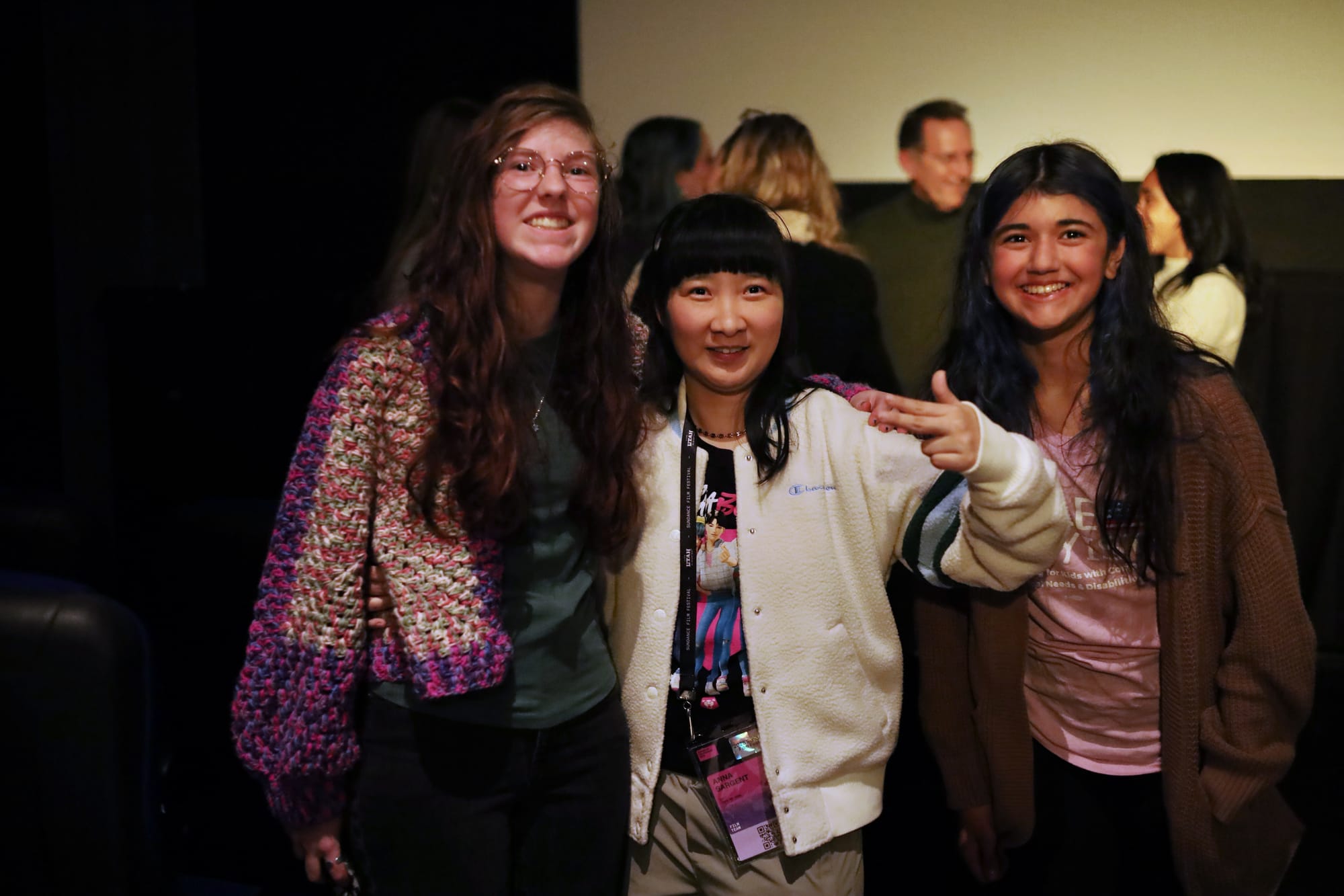 Anna Sargent, star of Take Me Home, poses with guests Carolina and Zoe. All have long dark hair and radiant smiles.