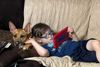 Cole and a canine friend lounging on the couch